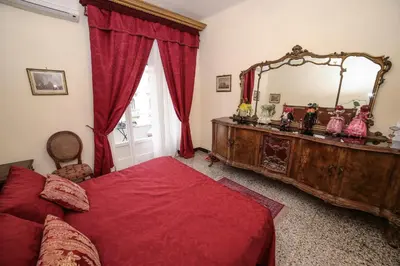 Letto o letti in una camera di WELL COME - Lungomare SANTA LUCIA