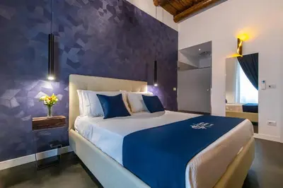 Letto o letti in una camera di Santa Chiara Inn