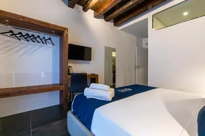 Letto o letti in una camera di Santa Chiara Inn