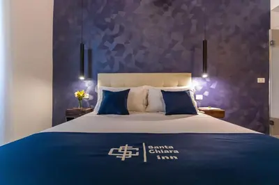 Letto o letti in una camera di Santa Chiara Inn