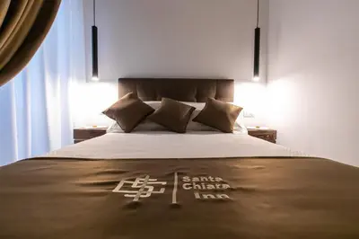 Letto o letti in una camera di Santa Chiara Inn