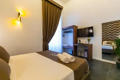 Letto o letti in una camera di Santa Chiara Inn