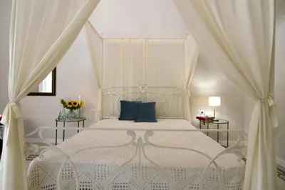 Letto o letti in una camera di Palà Suites