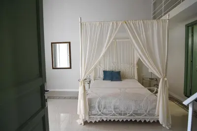 Letto o letti in una camera di Palà Suites
