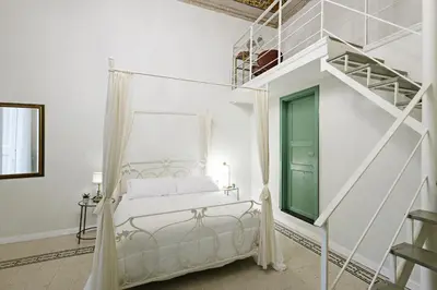 Letto o letti in una camera di Palà Suites