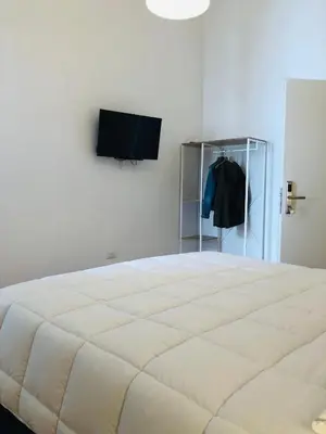 Letto o letti in una camera di Dimora Paladino