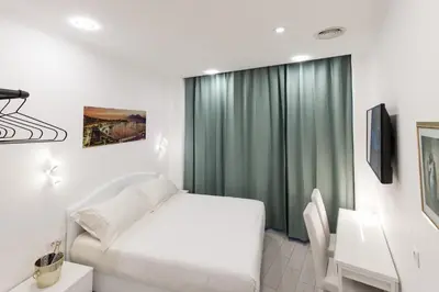 Letto o letti in una camera di MERGELLINA AMORE e FANTASIA