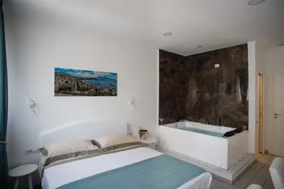 Letto o letti in una camera di MERGELLINA AMORE e FANTASIA