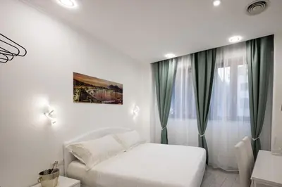 Letto o letti in una camera di MERGELLINA AMORE e FANTASIA