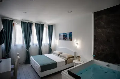Letto o letti in una camera di MERGELLINA AMORE e FANTASIA