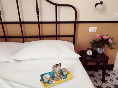 Letto o letti in una camera di suite fontanelle
