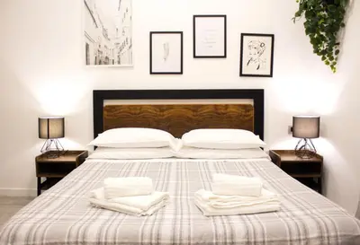 Letto o letti in una camera di It's Napoli Apartment