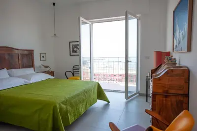 Letto o letti in una camera di B&B ICHOME NAPOLI - Maison d'Artiste