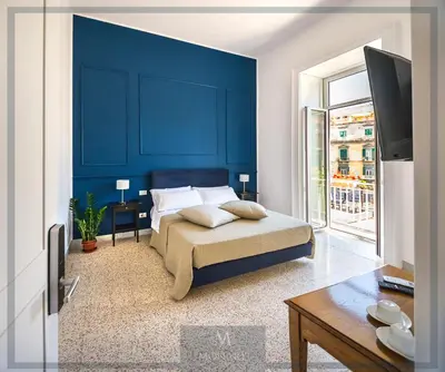 Letto o letti in una camera di MONART HOSPITALITY Cavour