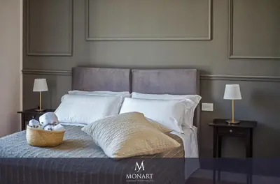 Letto o letti in una camera di MONART HOSPITALITY Cavour