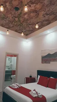 Letto o letti in una camera di I Tesori di Napoli