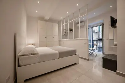 Letto o letti in una camera di Casa Vacanze Santa Teresella 40