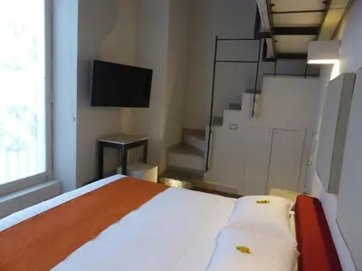 Letto o letti in una camera di Micalò Art Rooms