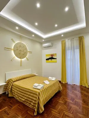 Letto o letti in una camera di SoLuMa' Chiaja Rooms