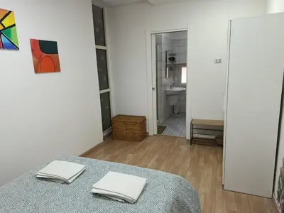 Letto o letti in una camera di Otto di denari