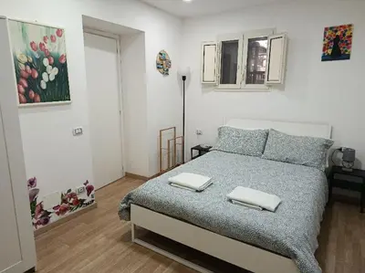 Letto o letti in una camera di Otto di denari