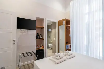 Letto o letti in una camera di Napoli Visit Home