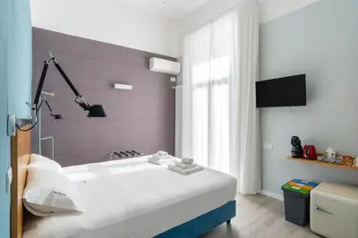 Letto o letti in una camera di Napoli Visit Home