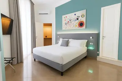 Letto o letti in una camera di Sanfelice 33 Luxury Suites