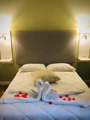 Letto o letti in una camera di Alcaprì Suite Napoli Centro