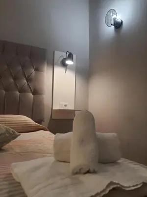Letto o letti in una camera di Alcaprì Suite Napoli Centro