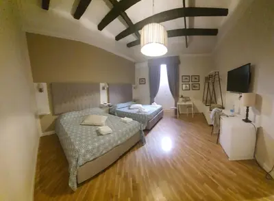 Letto o letti in una camera di Alcaprì Suite Napoli Centro