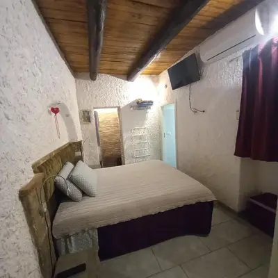 Letto o letti in una camera di La Grotta