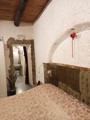 Letto o letti in una camera di La Grotta