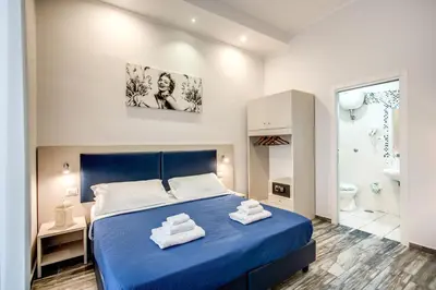 Letto o letti in una camera di Napoli's Gold