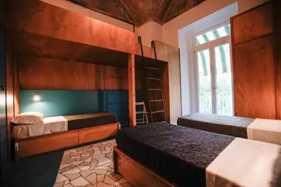 Letto o letti in una camera di NAP Hostel Spaccanapoli