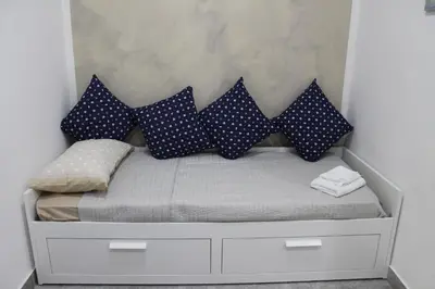 Letto o letti in una camera di riccia, frolla e babbà