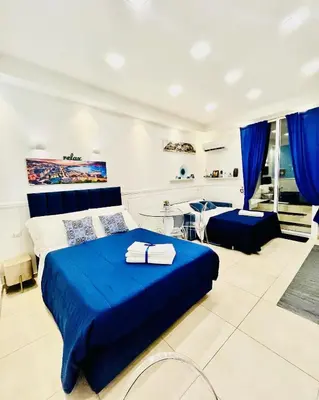 Letto o letti in una camera di Donn'Anna Naples City Center