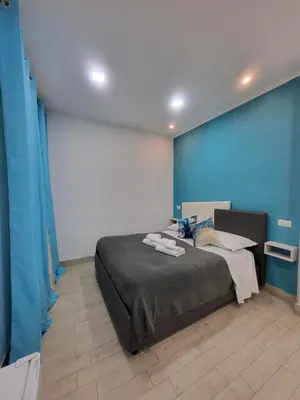 Letto o letti in una camera di New Era Rooms