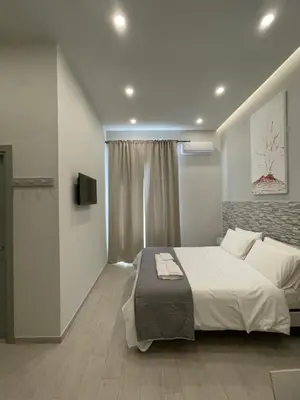 Letto o letti in una camera di Naptown Rooms