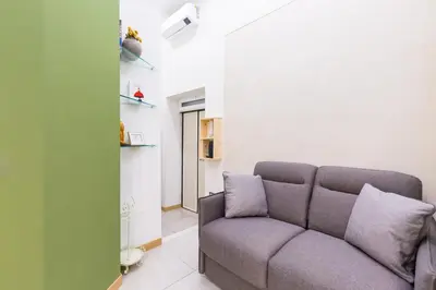 Area soggiorno di BAUBO sulla via dei presepi by Napoliapartments