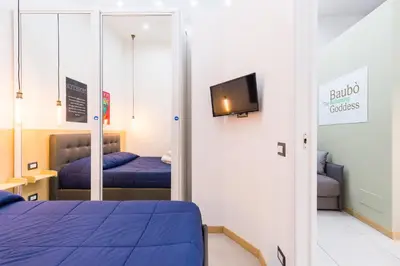 Letto o letti in una camera di BAUBO sulla via dei presepi by Napoliapartments
