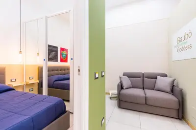 Letto o letti in una camera di BAUBO sulla via dei presepi by Napoliapartments