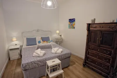 Letto o letti in una camera di Titti e Nonna