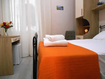 Letto o letti in una camera di Essenza di Napoli