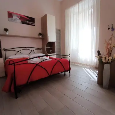 Letto o letti in una camera di Essenza di Napoli