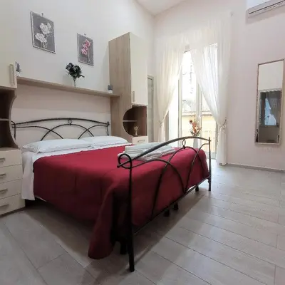 Letto o letti in una camera di Essenza di Napoli