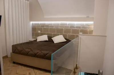 Letto o letti in una camera di Bottega Orafa