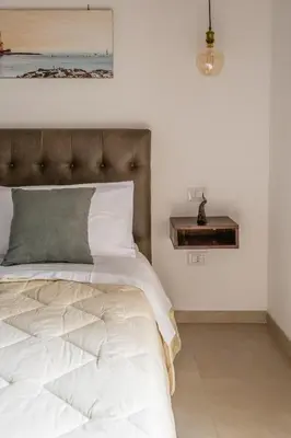 Letto o letti in una camera di Residenza San Gregorio Armeno - Roots Partenopee