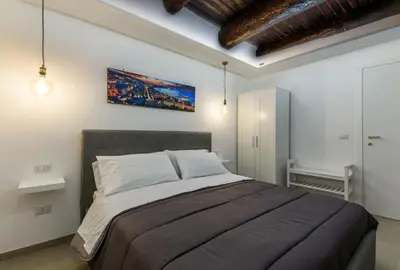 Letto o letti in una camera di Residenza San Gregorio Armeno - Roots Partenopee