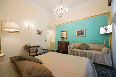 Letto o letti in una camera di B&B Residenza Via Dei Mille